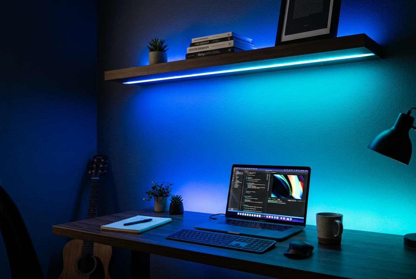 LIFX SuperColor lightstrip running along a shelf above a desk producing a bright, saturated, even color wash on the wall